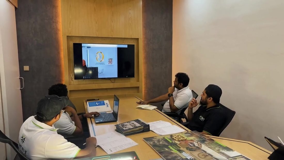 Point Five team reviewing a project design, drawings and material samples