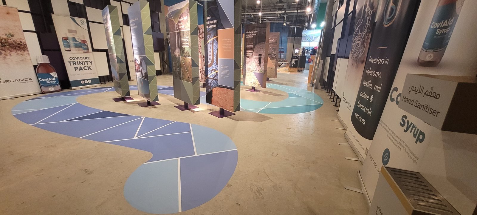 Exhibition pavilion with printed floor graphics and display panels