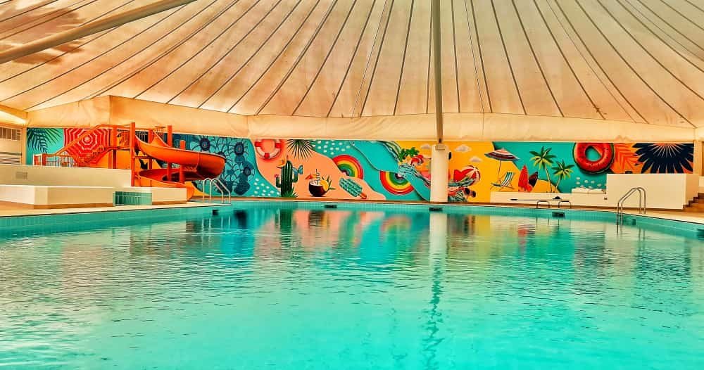 Printed mural on a pool-side wall