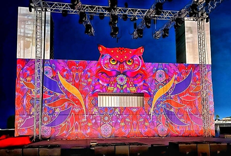 Colourful printed owl artwork stage backdrop on truss